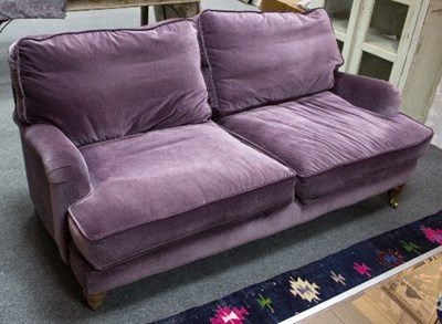Lot 24 - A modern purple velvet three seater settee,...