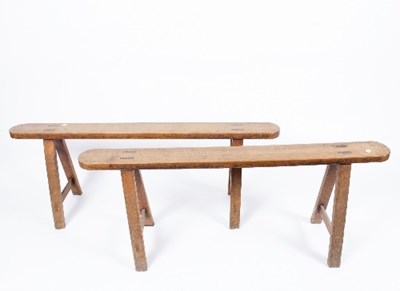 Lot 30 - A pair of country made benches on trestle...