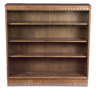 Lot 40 - An oak bookcase with fluted frieze and base,...