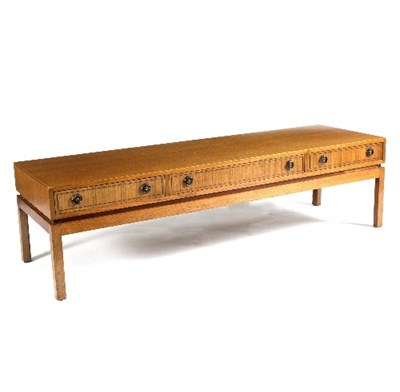 Lot 44 - A low teak coffee table, fitted three double...