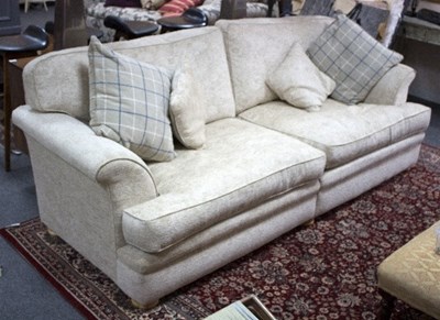 Lot 53 - A large upholstered sofa, fitted loose seats...