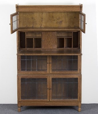 Lot 86 - A Minty sectional oak secretaire bookcase with...
