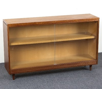 Lot 100 - A teak bookcase by White & Newton, enclosed by...