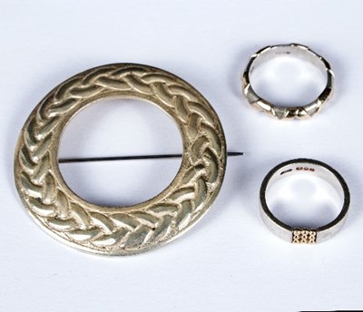 Lot 518 - A Celtic circular silver brooch by Robert...