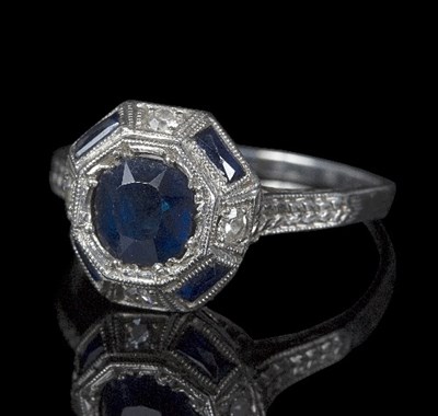 Lot 528 - An Art Deco diamond and sapphire dress ring,...