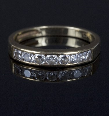 Lot 554 - A diamond half eternity ring, set seven round...