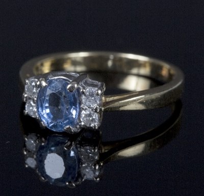 Lot 557 - A sapphire and diamond dress ring, the oval...