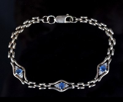 Lot 562 - A sapphire and diamond bracelet, set three...