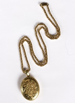 Lot 568 - An 18ct gold oval locket with floral engraving...