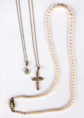 Lot 570 - A diamond set cross pendant on a 9ct gold...