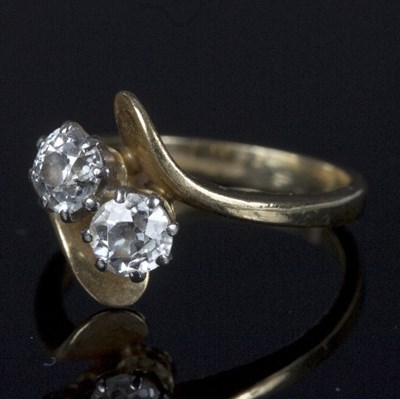 Lot 571 - A diamond crossover ring, set two old cut...