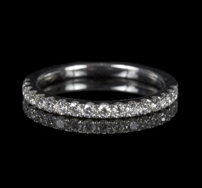 Lot 583 - A diamond half eternity ring set with...