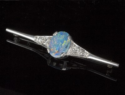 Lot 586 - An opal and diamond bar brooch, the oval opal...