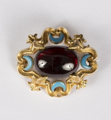 Lot 598 - A garnet and enamelled brooch, the oval...