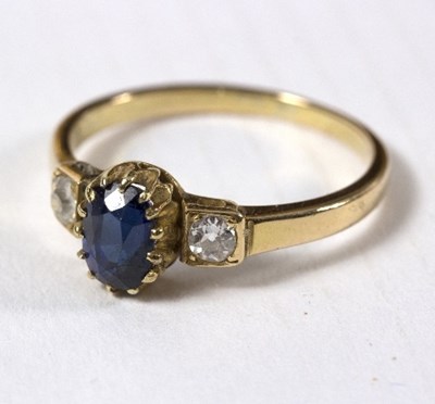 Lot 603 - A sapphire and diamond three-stone ring, the...