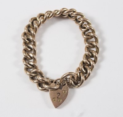 Lot 624 - A 9ct gold curb link bracelet with...