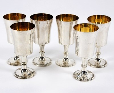 Lot 660 - A set of six silver and silver gilt goblets,...