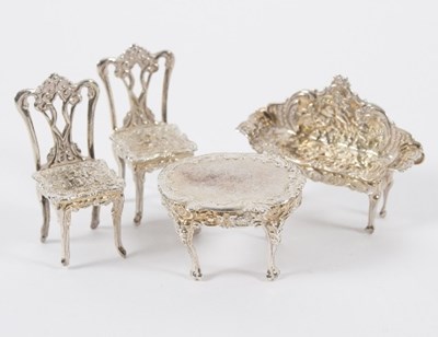 Lot 664 - A set of silver dolls house furniture, David...