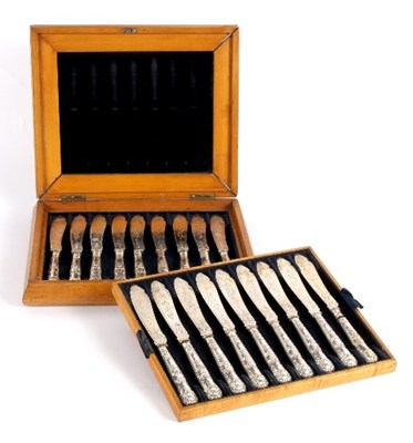 Lot 688 - A set of eighteen silver fish knives, the...