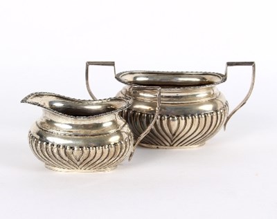 Lot 747 - A silver sugar basin and cream jug, London...