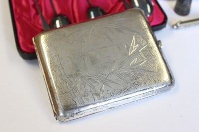 Lot 782 - An Oriental silver cigarette case stamped...