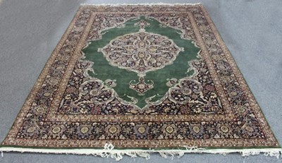 Lot 806 - An Eastern style carpet with central medallion...