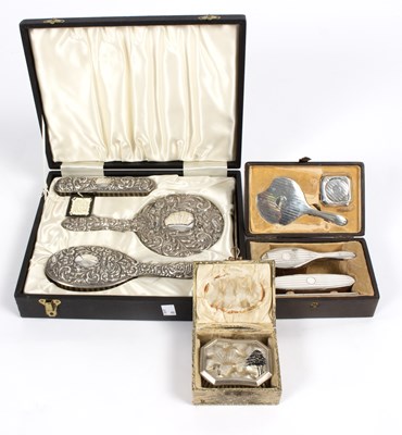 Lot 6 - A silver three-piece dressing set with repouss?...