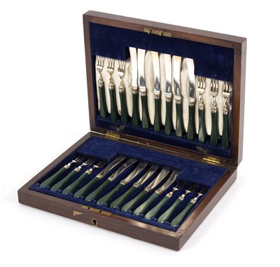 Lot 53 - A set of twelve fruit knives and forks, with...
