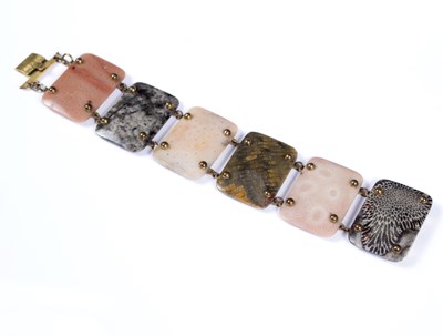 Lot 76 - A hardstone bracelet of six varied oblong...