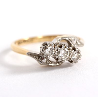 Lot 98 - A diamond three-stone ring, the central stone...