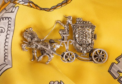 Lot 93 - A 1940s silver and marcasite carriage brooch watch