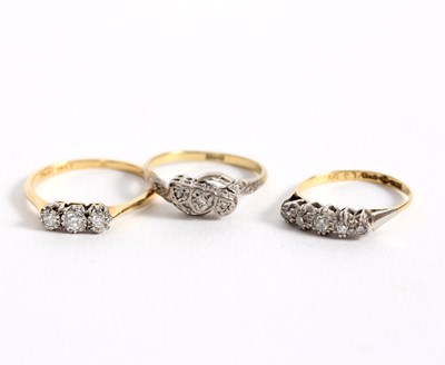 Lot 105 - Three diamond rings, comprising a three stone...