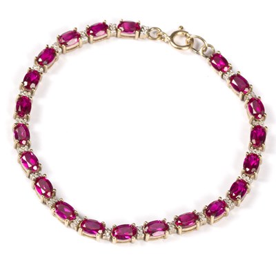 Lot 108 - A ruby and diamond line bracelet, the oval...