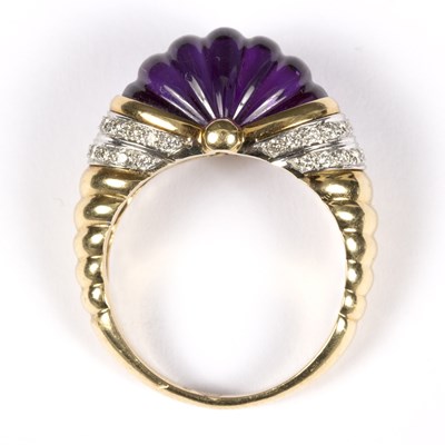 Lot 111 - An amethyst and diamond dress ring, the carved...