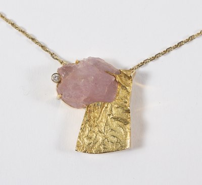 Lot 114 - An 18ct gold, rose quartz and diamond pendant,...