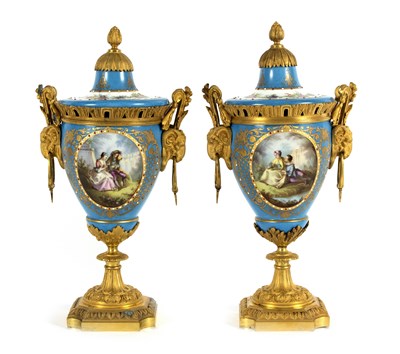 Lot 186 - A pair of Sevres style porcelain urns and...