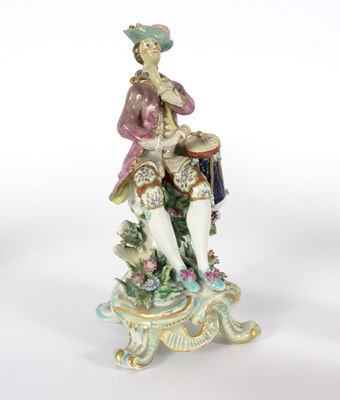 Lot 188 - A Bow porcelain figure of a drummer, seated on...