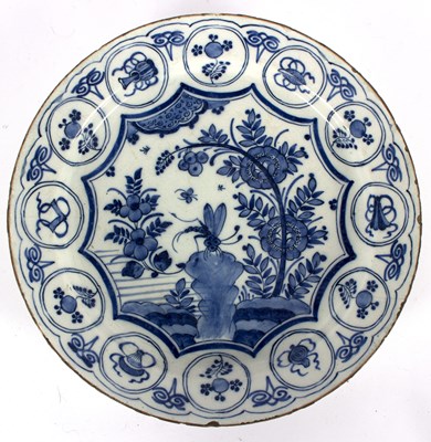 Lot 191 - An 18th Century Delft blue and white charger,...