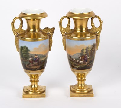 Lot 221 - A pair of Paris gilded vases, each painted a...