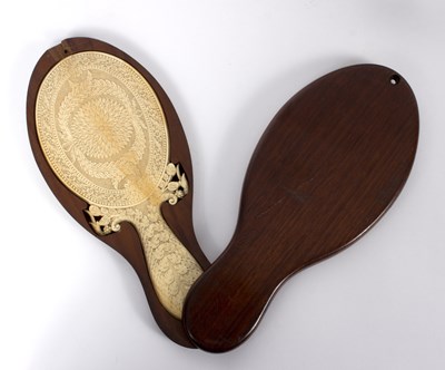 Lot 291 - A 19th Century Indian ivory hand mirror,...