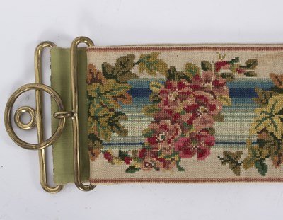 Lot 569 - A late Regency needlework bell pull with brass...