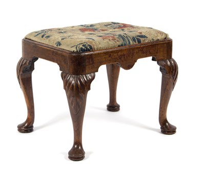 Lot 632 - A George I walnut stool, with carved acanthus...