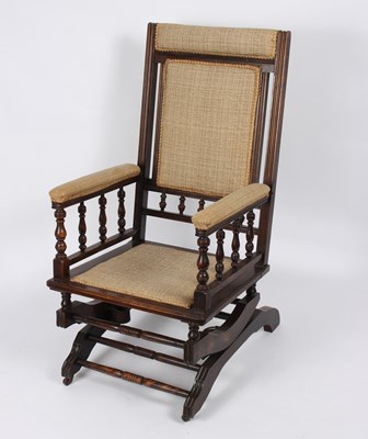 Lot 650 - A late Victorian beech framed rocking chair...