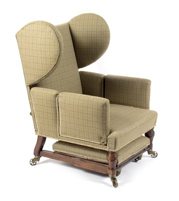 Lot 652 - A late 19th Century wingback reclining...