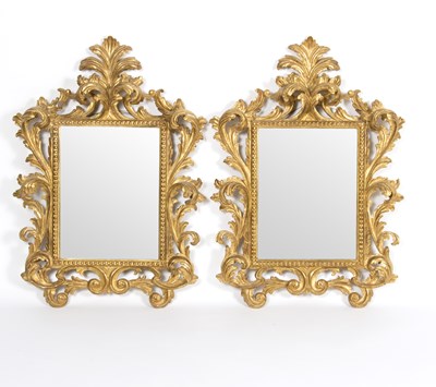 Lot 661 - A pair of Rococo style gilt framed mirrors...