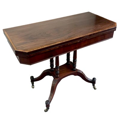 Lot 665 - A 19th Century mahogany fold-over tea table...