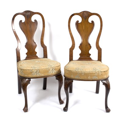 Lot 669 - A pair of George II walnut side chairs, with...