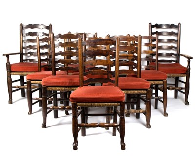 Lot 676 - A set of ten ladder back chairs, with rush...