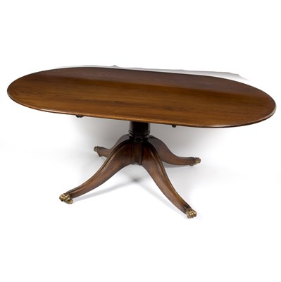 Lot 692 - An oval mahogany dining table on a turned...