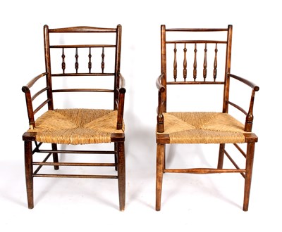 Lot 707 - Two William Morris style Sussex chairs